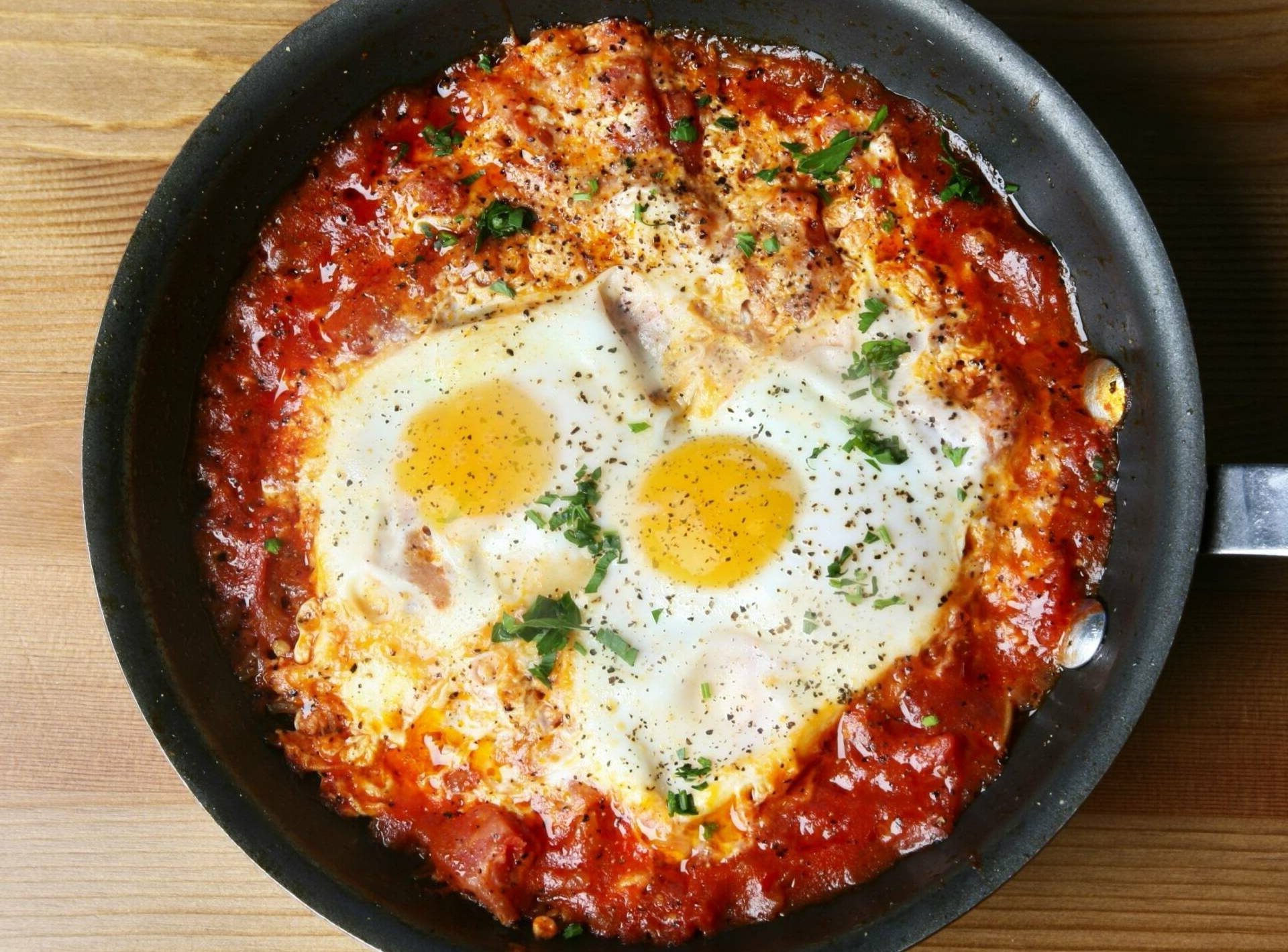Shakshuka tomato sauce simmering