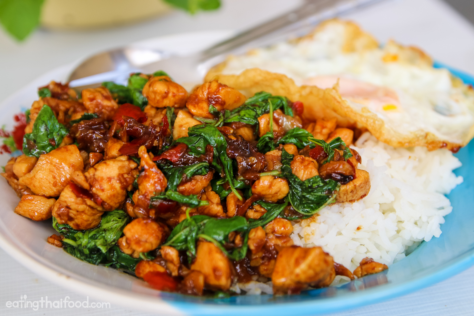 Stir-frying aromatics for Thai basil chicken