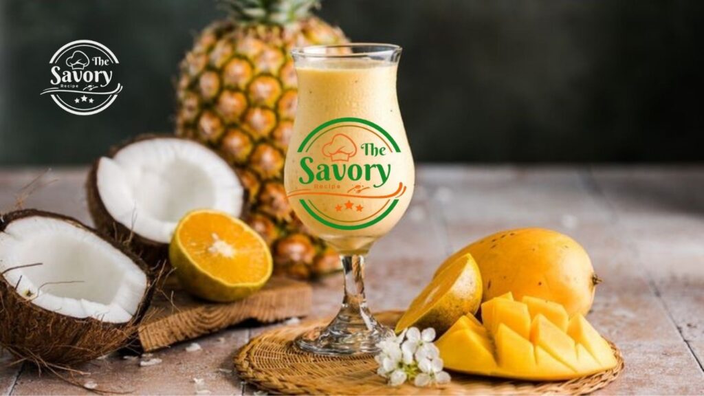 Tropical Sunrise Smoothie in a glass with tropical fruits